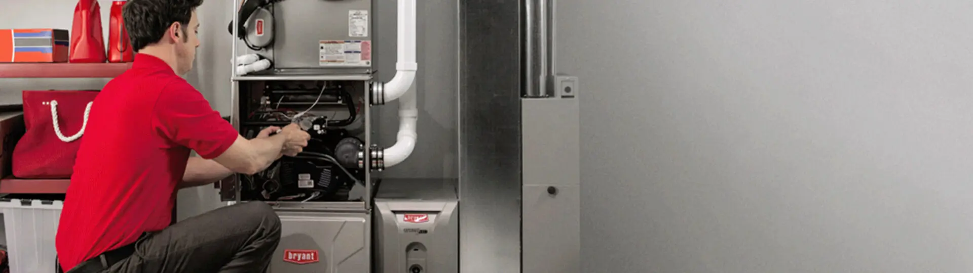 Technician inspecting a residential furnace