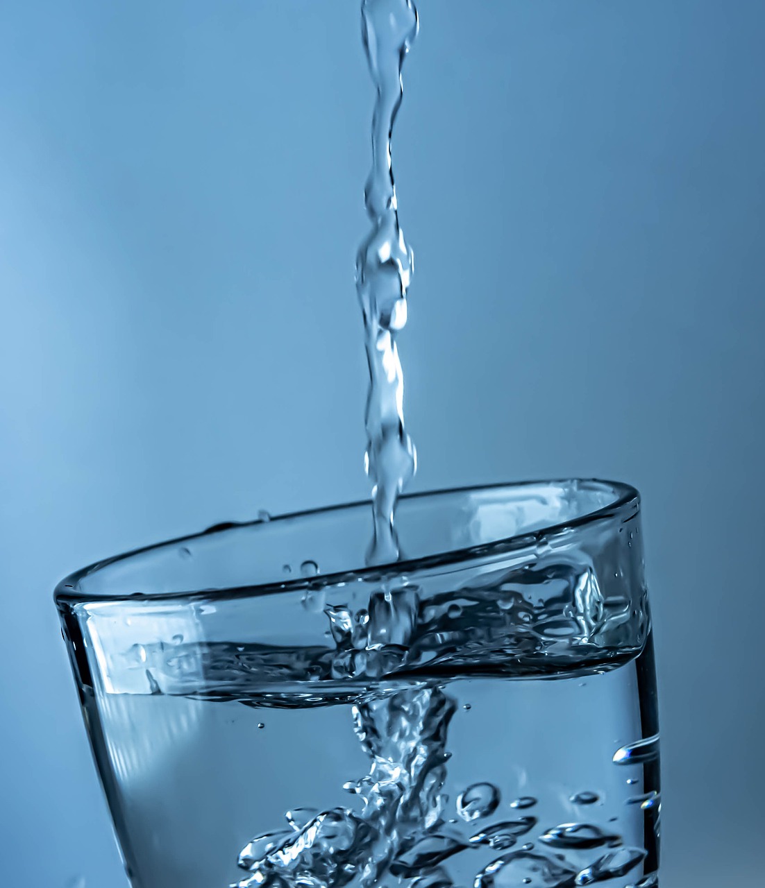 Clean water pouring into a glass